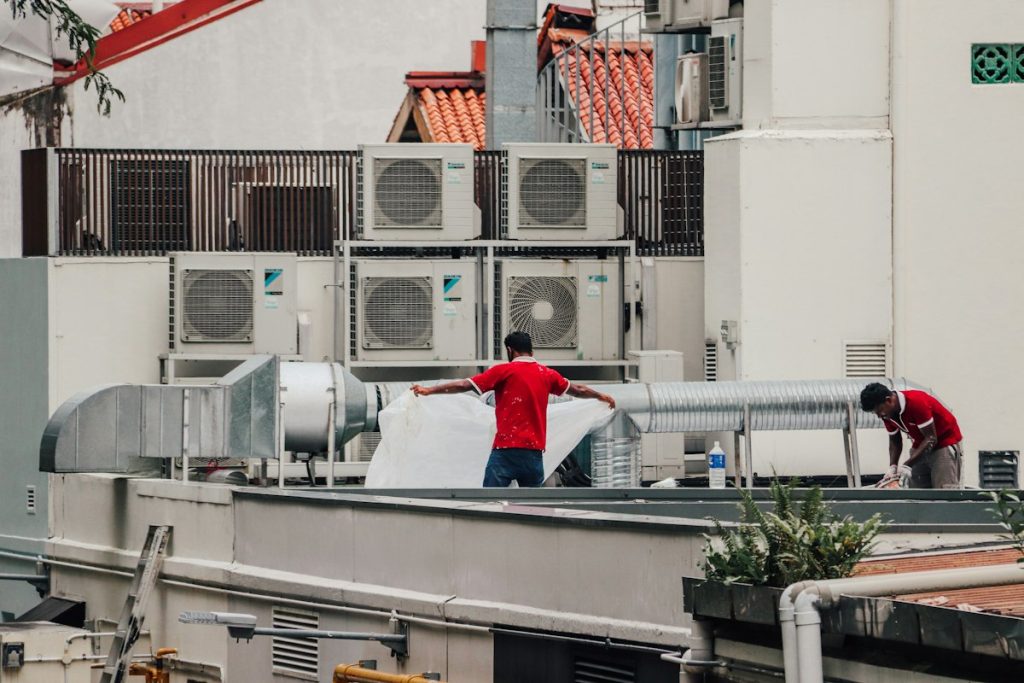 HVAC maintenance technicians on rooftop units